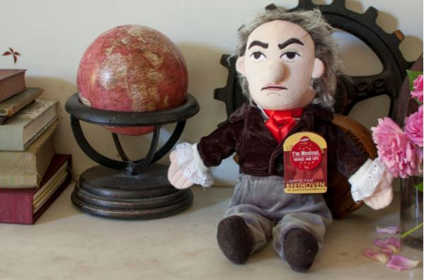 beethoven doll by small desk globe